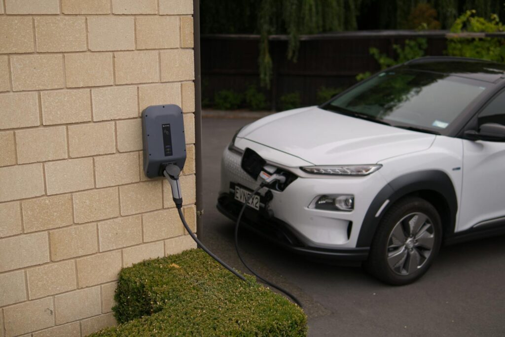 Black Charger Plugged-In on White Car