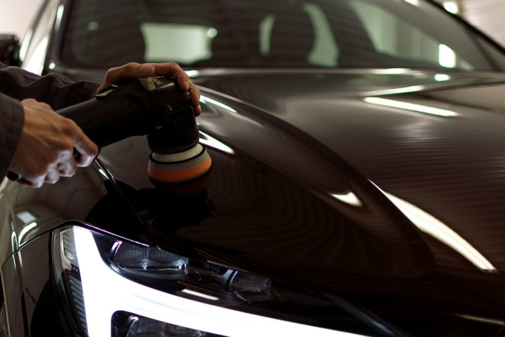 a person taking a picture of a car