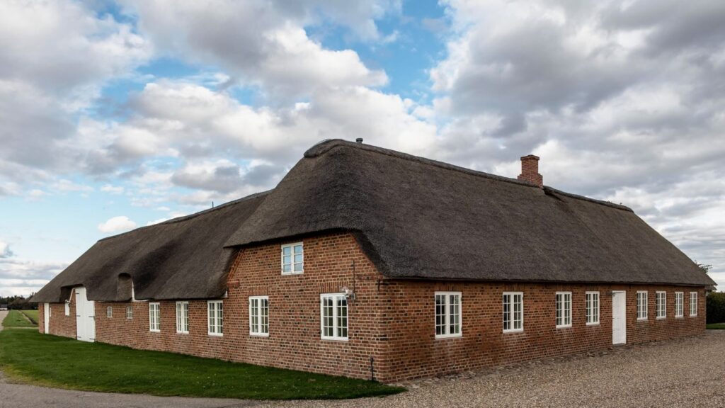 Explore this picturesque Nordic thatched cottage set in the idyllic Danish countryside.
